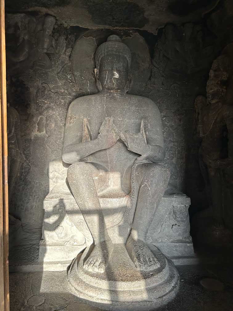 Buddha statue carved from rock in Ellora cave